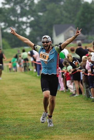 Courtesy photo
Dan Henry of Cambridge, Mass., takes part in last year’s Pumpkinman Triathlon. The event is enjoying its highest profile.