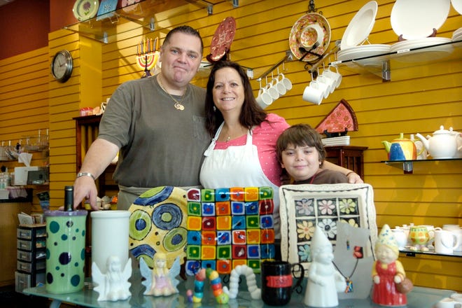 Dan and Teresa Barion, here with their son, Nicholas, 10, have opened Arts A 
Blaze Studio at 8111 Lakewood Main Street, Suite 107.STAFF PHOTO / THOMAS 
BENDER