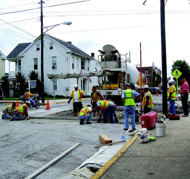 Crews laid a final section of concrete under the watchful eyes of several inspectors and a local citizen. JVH Excavating is still completing work on Jefferson Street but Baltimore Street is now open to unrestricted travel. It will remain that way until PennDOT starts its paving project, which will be soon.