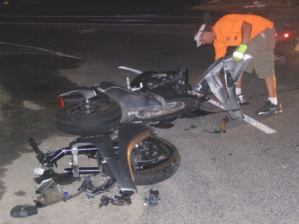 A towing company employee works at the scene of a motorcyle accident that occurred around 8:30 p.m. Friday at the intersection of Hwy. 42 and Old Jefferson in Prairieville.