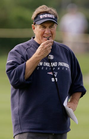 Patriots head coach Bill Belichick blows his whistle during the morning session of training campon Tuesday.