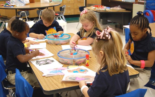 Students in Melanie Guillory’s kindergarten class at Spanish Lake Primary School work on an assignment Wednesday morning. Spanish Lake is one of three new public schools to open this year in Ascension Parish.