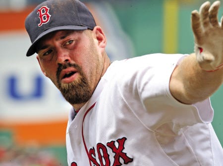 Red Sox infielder Kevin Youkilis was suspended for five games after charging the mound against Detroit on Tuesday.