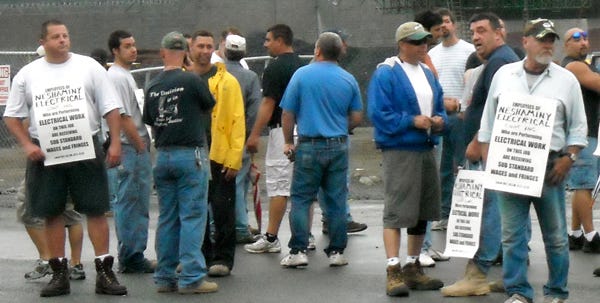 Members of the International Brotherwood of Electrical Workers Local 102 line Route 611 during an 'informational picket' at the construction site of the new Giant store in Bartonsville.