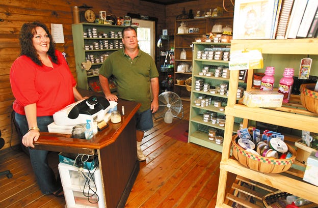 Taryn and Bryan Strob in their Olde Thyme General Store, located on Illinois 116 east of London Mills. The shop specializes in spices, flour, and other baking goods, as well as some dry goods and cold drinks.