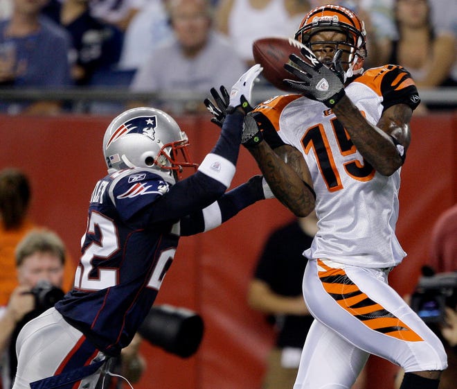 Bengals wide receiver Chris Henry hauls in a touchdown as Patriots cornerback Terrence Wheatley tries in vain to break up the play during the Pats' 7-6 loss on Thursday night in a preseason game in Foxboro.