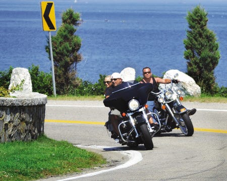 Rich Beauchesne/rbeauchesne@seacoastonline.com
Motorcycle riders cruise along twisty turns of Route 1A in North Hampton.
