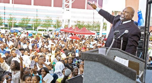 Bishop T.D. Jakes asks the crowd to make some noise during the July 2006 opening of MegaFest at International Plaza in Atlanta.