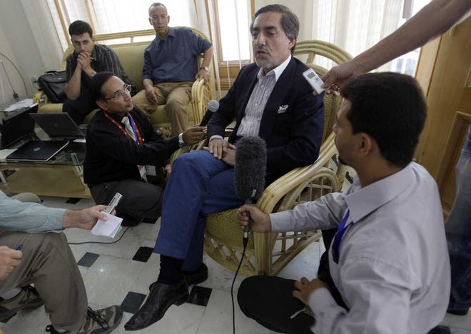 Afghan presidential candidate Abdullah Abdullah meets with the media in Kabul on Saturday.
