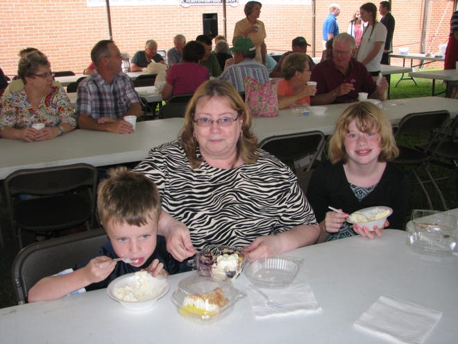 Debbie Otto (center) and niece and nephew Hannah and Riley Potter were among hundreds who stopped by the fifth annual Ice Cream Social at the Boone County Historical Museum in Belvidere.