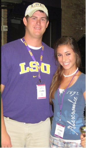 Ashley is pictured with Rob Dowie Drum Major for the LSU Tiger Band.
