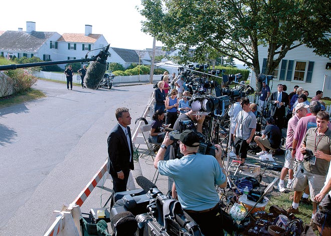Local and national media congregate outside the Kennedy Compound in Hyannisport.