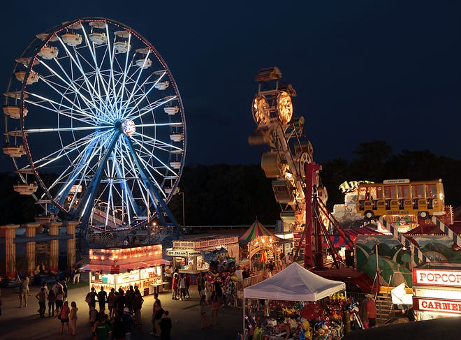 The Ferris wheel is aglow with lights as the Marshfield Fair kicks off Aug. 21.