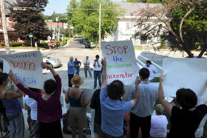 Members of Residents for Alternative Trash Solutions protest yesterday in front of Southbridge Town Hall in hopes of bringing attention to plans for a waste-to-energy project at the town landfill.