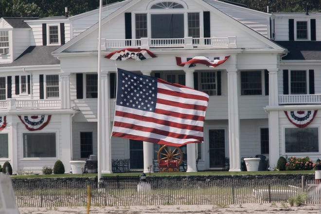 A large flag flies at half-staff outside a house near the Kennedy family compound in Hyannis Port, Mass. Sen. Edward M. Kennedy, D-Mass., died of brain cancer late Tuesday night.