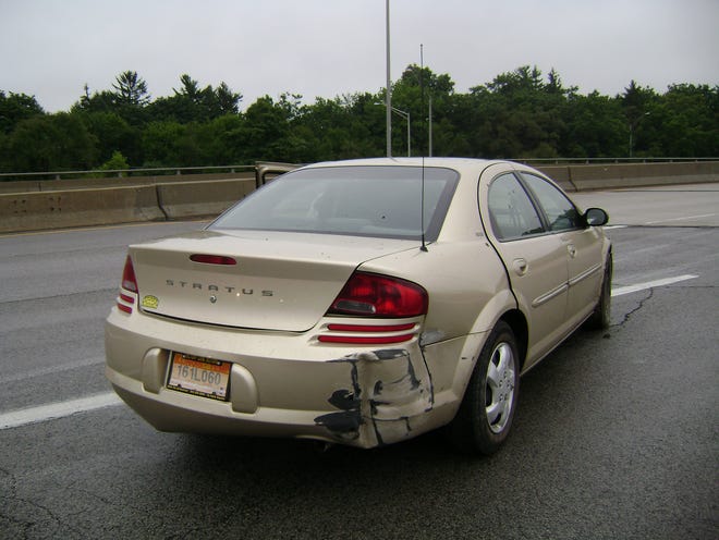 A gold Dodge Stratus hit a guardrail Friday, Aug. 28, 2009, after the driver fled from police. Police deployed a Taser twice after the man ran from police across six lanes of Illinois 251.