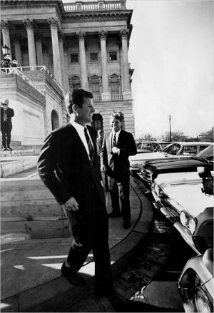 Senator Edward M. Kennedy joked with his brother Robert, background, on Capitol Hill in 1965.