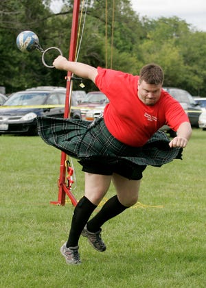 Josh Roslik of Madison, Wis., competes in the weight over bar portion of the Scottish Highland Games during the Cherry Valley Festival Days on Saturday, Aug. 29, 2009, at Baumann Park in Cherry Valley.