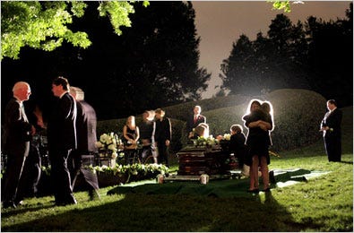 Kennedy family members and friends gathered around the gravesite at the funeral on Saturday for Senator Edward M. Kennedy at Arlington National Cemetery.