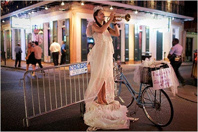 A French Quarter street performer seeks an audience on Friday.
