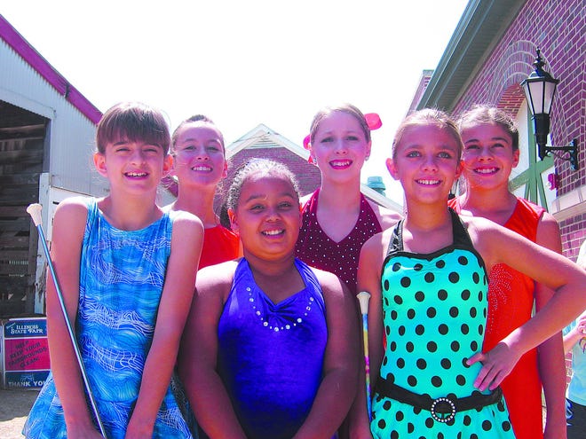 Haley Sims, Kyrrah Randolph, Emma Plate, Kirra Damewood, Caiti Kozelichki, and Lindsay Holmberg of the Warren County YMCA Twirlers after competing at the Illinois State Fair.
