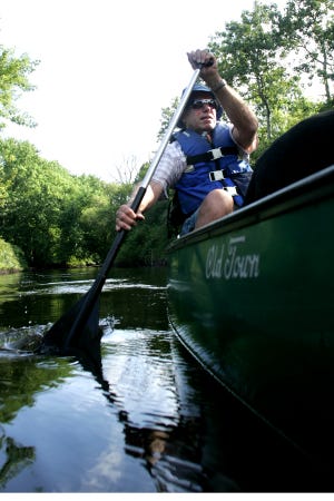 Dave Hodgdon, of Blue Hill Adventures, paddles his way upstream on the Neponset River, from Signal Hill in Canton. Hodgdon who has been canoeing in the area for over 30 years, offers guided tours now through October.