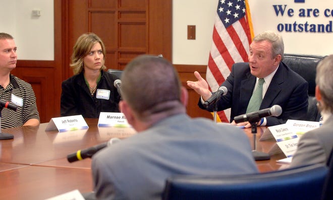 U.S. Sen. Dick Durbin, D-Ill., leads a discussion on health care at Methodist Medical Center on Thursday afternoon. At left are Jeff and Marnae Roberts, who found themselves and their two young children without health insurance when they were both laid off earlier this year.