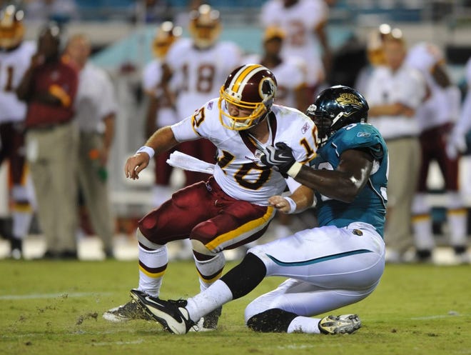 RICK WILSON/The Times-UnionJaguars defensive end James Wyche (right) pressures Redskins rookie quarterback Chase Daniel, forcing an incomplete pass in the third quarter on Thursday.