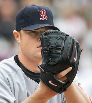 Red Sox starting pitcher Jon Lester prepares to pitch during the first inning.