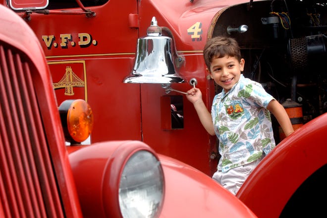 Anthony Joseph, 4, rings the bell on a 1948 Seagrave Canopy Cab pumper fire truck during the Central Illinois All-Truck Show at Jim McComb Chevrolet in Peoria Sunday.