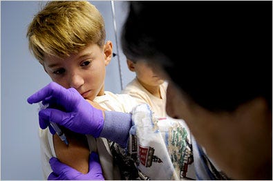PREVENTION Charlie Houley, 8, of Annapolis, Md., receiving a flu shot.
