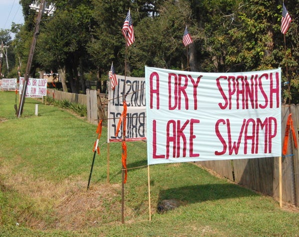 Signs lining Hwy. 74 just outside of Ascension Parish reference the changes in Spanish Lake Swamp. The signs read: “A dry Spanish Lake Swamp means BR Loop will run thru Prairieville. Big land owners 1, Prairieville 0.”