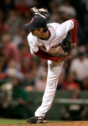 Red Sox starter Clay Buchholz delivers a pitch in the seventh inning of the Red Sox' 10-0 victory on Tuesday night at Fenway Park.