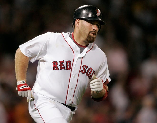 Kevin Youkilis rounds the bases after hitting a home run off the Orioles' David Hernandez in the first inning of the Red Sox' 10-0 victory on Tuesday night at Fenway Park.