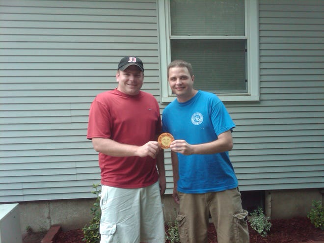 Justin Clark, 30, left, and Chet Strickfaden, 30, both of Pekin found the Pepsi Marigold Medallion 2009
at 10:45 a.m. Thursday in some bushes north of the Miller Center parking lot. They win a four-day three-night trip to Cancun, Mexico or Las Vegas.