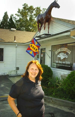 Owner Gerie Schell stands outside Equine Essentials.