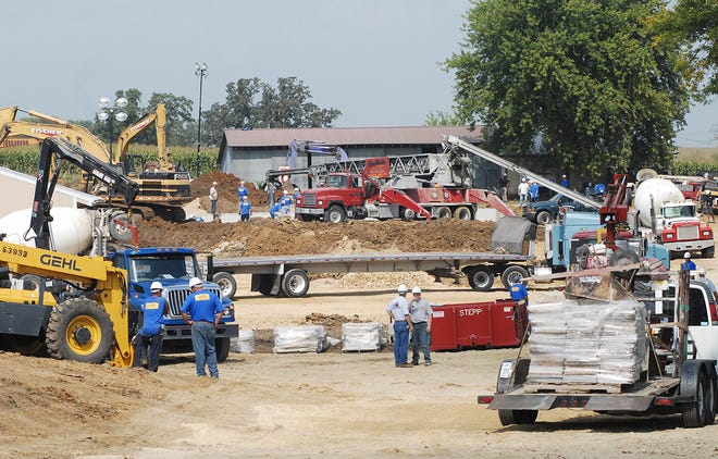 The Extreme Makeover: Home Edition site in Lena, seen from U.S. 20, is bustling Thursday afternoon.