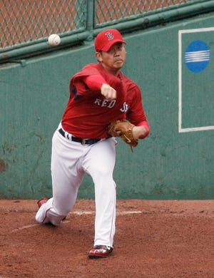 Daisuke Matsuzaka throws in the bullpen prior to the Red Sox-Rays game on Saturday night at Fenway Park.