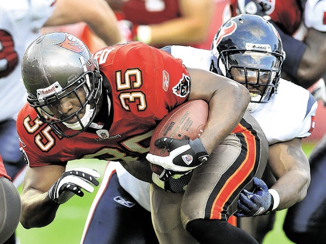 Tampa Bay Buccaneers fullback B.J. Askew (35) is caught from behind by Houston Texans linebacker Kevin Bentley (57) during the first quarter of an NFL preseason football game on Friday, Sept. 4, 2009, in Tampa, Fla.