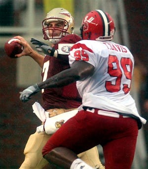 Florida State’s Christian Ponder is pressured by Jacksonville State’s Torrey Davis (former Gator) on Saturday in Tallahassee.
