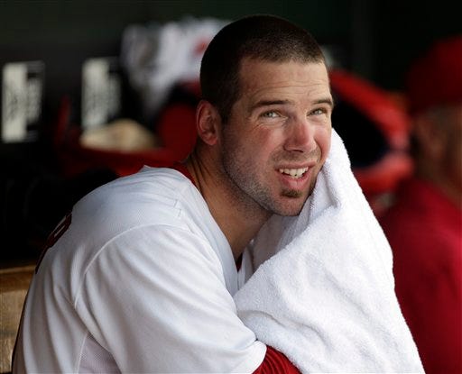 St. Louis Cardinals starting pitcher Chris Carpenter towels off in the dugout during the fourth inning of a baseball game against the Atlanta Braves on Sunday, Sept. 13, 2009, in St. Louis. (AP Photo/Jeff Roberson)
