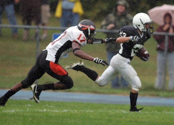Apponequet's Zacl Nanfelt (right) runs away from Middleboro's Carlton Dyer for a score during Saturday's 28-6 win at Apponequet Regional High School.