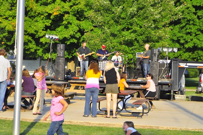 The rock band Straightline performs as festivalgoers enjoy the chance to dance.