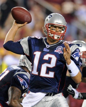 Patriots quarterback Tom Brady throws a pass during the first half of Friday night's Pats-Redskins exhibition game in Landover, Md.