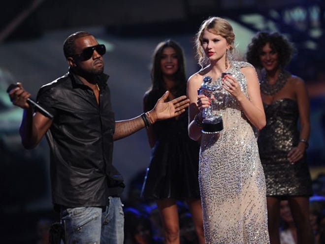 kayne west, left, takes the wind out of winner Taylor Swift's sails with his disparaging remarks during the MTV Video Music Awards show on Sunday.
