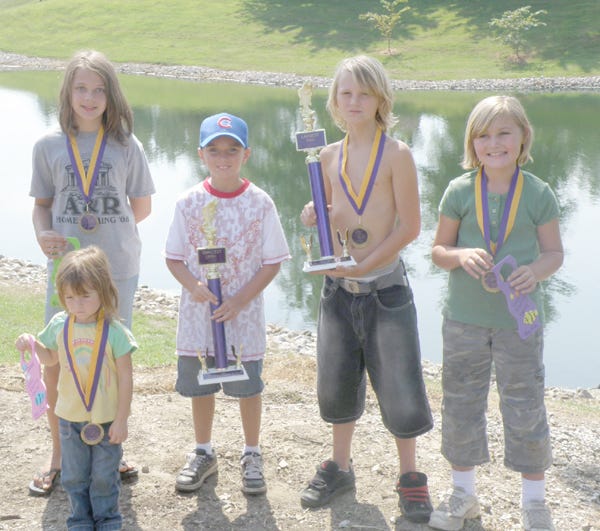Trophy and medallion winners at the Viola kid's fishing derby from left are Emma Austin (front), Kaylee Esp, Casey Baugh, Starr Gomez and Madison Williams.