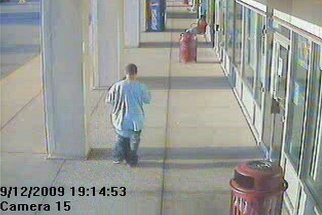 A still frame from a Holland Town Center security camera shows the person police believe assaulted a 10-year-old girl Saturday evening.