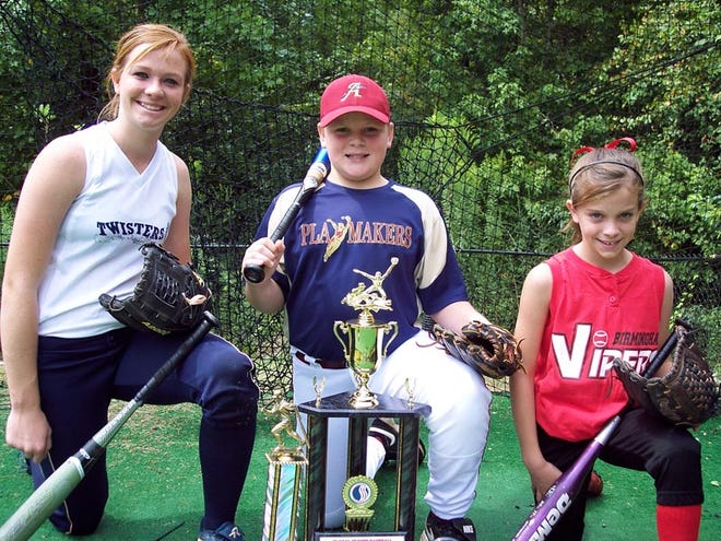 Keelie Housley, left to right, Taylor Clemmons and Lindsie Housley display the trophies they received from competing in softball and baseball tournaments. Keelie was in the U.S. Fastpitch Association World Series. Taylor was in the USSSA Baseball World Series. Lindsie was in the National Softball Association State Tournament. Keelie and Lindsie are sisters, and Taylor is their cousin. Photo by Becky Hopf.