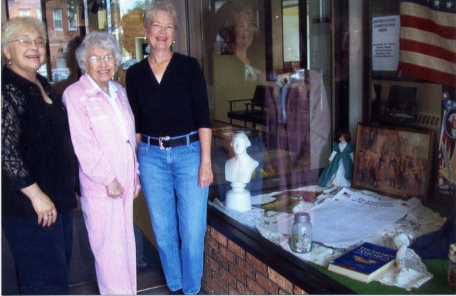 The Constitution Week window display at MidAmerica National Bank in Lewistown was prepared by Roberta McCormick (right), Good Citizens Chairman; Georgia Wilcoxen (center), Constitution Week Chairman; and Joan Johnson-Blackwell (left), DAR Chapter Historian for Thomas Walters Chapter NSDAR.