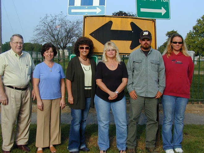 The 2009 Key to Friendship was found on a sign near Greenwood Cemetery by Brandon Hammond, Justina Vaughn, and Kim Hammond, all of Canton. An early-morning ceremony at the site recognizes the group. Pictured from left are: Arlen Higgs, Brenda Shawgo, and Sheri DeLost, all of Jim Maloof Realty; and Brandon, Kim, and Justina.